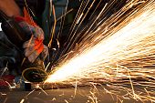 foto of people welding - sparks while grinding in a steel factory - JPG