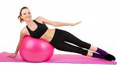 pic of fitness  - Young woman doing fitness exercises with gym ball isolated on white - JPG 