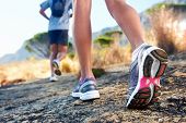 pic of fitness  - trail running marathon fitness feet on rock fitness and healthy lifestyle - JPG 