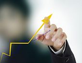 stock photo of investment  - hand  graph - JPG 