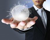 stock photo of earth  - holding a glowing earth globe in his hands - JPG 