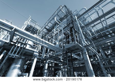 Picture or Photo of Oil industrial pipeline construction, two engineers standing on platform, blue toning idea