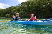 foto of oared  - Young Girl Kayaking in tropical mangroves - JPG 