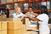 picture of food  - Volunteers Collecting Food Donations In Warehouse - JPG 