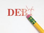 picture of debt  - Close up of a yellow pencil erasing the word  - JPG 