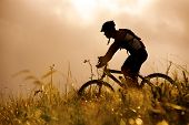 picture of fitness  - healthy fit man rides his mountainbike outdoors - JPG 