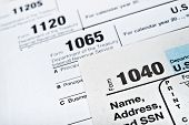stock photo of outcome  - U.S. Income Tax Return forms 1040 1065 and 1120
** Note: Shallow depth of field - JPG 