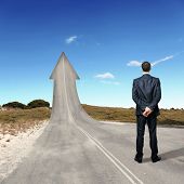 foto of competition  - Concept of the road to success with a businessman standing on the road - JPG 