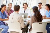 stock photo of meeting  - Medical Team Discussing Treatment Options With Patients - JPG 