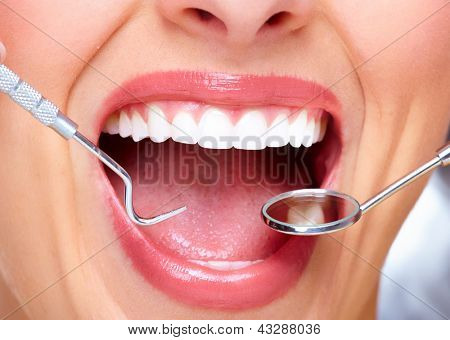 Picture or Photo of Beautiful woman smile. Dental health care clinic.