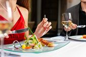 pic of restaurant  - Couple for romantic Dinner or lunch in a gourmet restaurant drinking wine and eating - JPG 