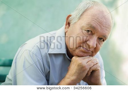Picture or Photo of Seniors portrait of contemplative old caucasian man looking at camera. Copy space