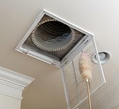 stock photo of home  - Dusting the vent for air conditioning filter in ceiling of modern home - JPG 