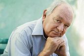 stock photo of man  - Seniors portrait of contemplative old caucasian man looking at camera - JPG 