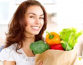 picture of food  - Happy Young Woman with vegetables in shopping bag  - JPG 