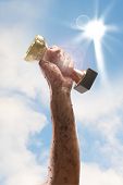 picture of competition  - hand holding a cup of the winner - JPG 