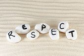 image of respect  - Respect word on group of stones with sand as background - JPG 
