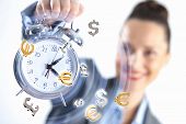 picture of time  - Time in business illustration with clock in hands of businesswoman
 - JPG 