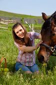 pic of horse  - attractive girl feeding horse on nature - JPG 