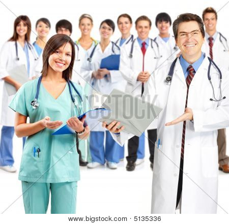 Picture or Photo of Smiling medical people with stethoscopes. Doctors and nurses over white background