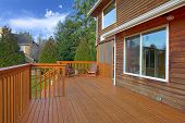 stock photo of home  - Back of the house with deck  and rustic cedar home - JPG 