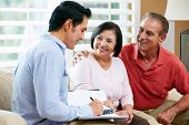image of home  - Financial Advisor Talking To Senior Couple At Home - JPG 