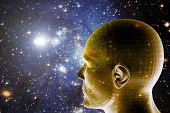 image of future  - universe background with a human head looking forward and in the future - JPG 