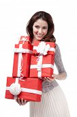 foto of wrapped  - Pretty woman hands many presents wrapped in red paper - JPG 