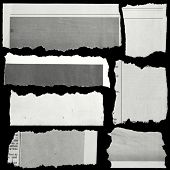 picture of newspaper  - Pieces of torn paper on black - JPG 