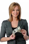 picture of money  - Beautiful young woman holding a stack of money isolated over white - JPG 