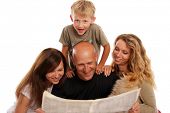 stock photo of newspaper  - Family reads the newspaper - JPG 