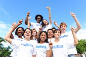 pic of group  - portrait of a happy and diverse volunteer group hands raised - JPG 