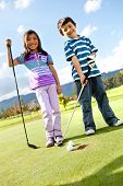 image of golf  - Kids at the course playing golf and looking happy - JPG 