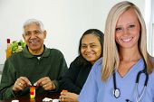 stock photo of health  - Home health care worker and an elderly couple - JPG 