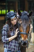 foto of friendship  - A friendship between cowboy girl and horse at the ranch - JPG 