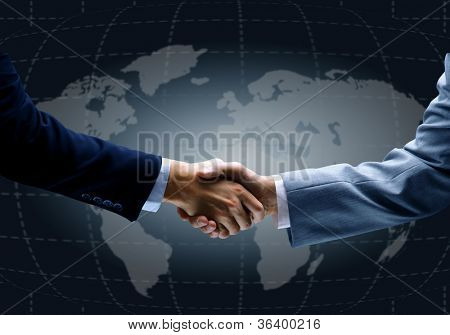 Picture or Photo of Handshake with map of the world in background