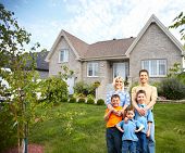 stock photo of investment  - Happy family near new house - JPG 
