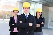 picture of construction  - A handsome business man and woman construction team at office building - JPG 