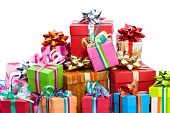 picture of wrapped  - Pile of colorful christmas presents isolated on white background - JPG 