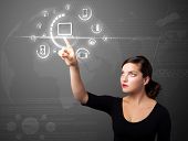 stock photo of business people  - Businesswoman pressing multimedia type of modern buttons with virtual background - JPG 