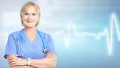 stock photo of health  - Family doctor over blue background - JPG 