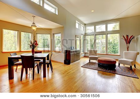 Picture or Photo of Fantastic modern living room home interior. Dining room. Huge green bright room with modern furniture.