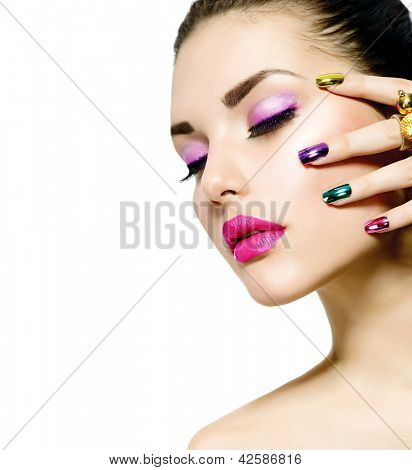 Picture or Photo of Fashion Beauty . Manicure and Make-up. Nail art. Beautiful Woman With Colorful Nails and Luxury Makeup. Beautiful Girl Face and Hand