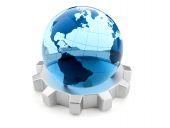 pic of business concept  - Glass Earth globe sitting on a gear  - JPG 