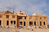 picture of construction  - Building site with new houses under construction - JPG 