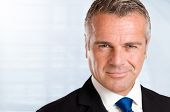 stock photo of businessmen  - Closeup portrait of satisfied mature businessman in his office with copy space - JPG 