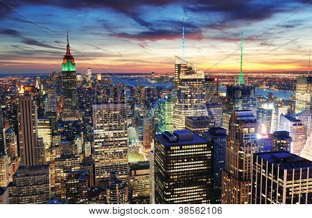 Picture or Photo of New York City skyline with urban skyscrapers at sunset.