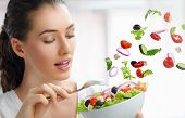 image of food  - A beautiful girl eating healthy food - JPG 