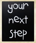 picture of step  - "Your next step" handwritten with white chalk on a blackboard - JPG 