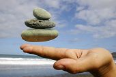 foto of steady  - pebbles floating at fingertips - JPG 